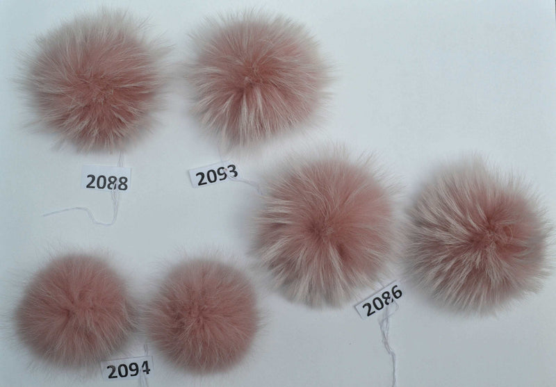 pink powder raccoon pom pom