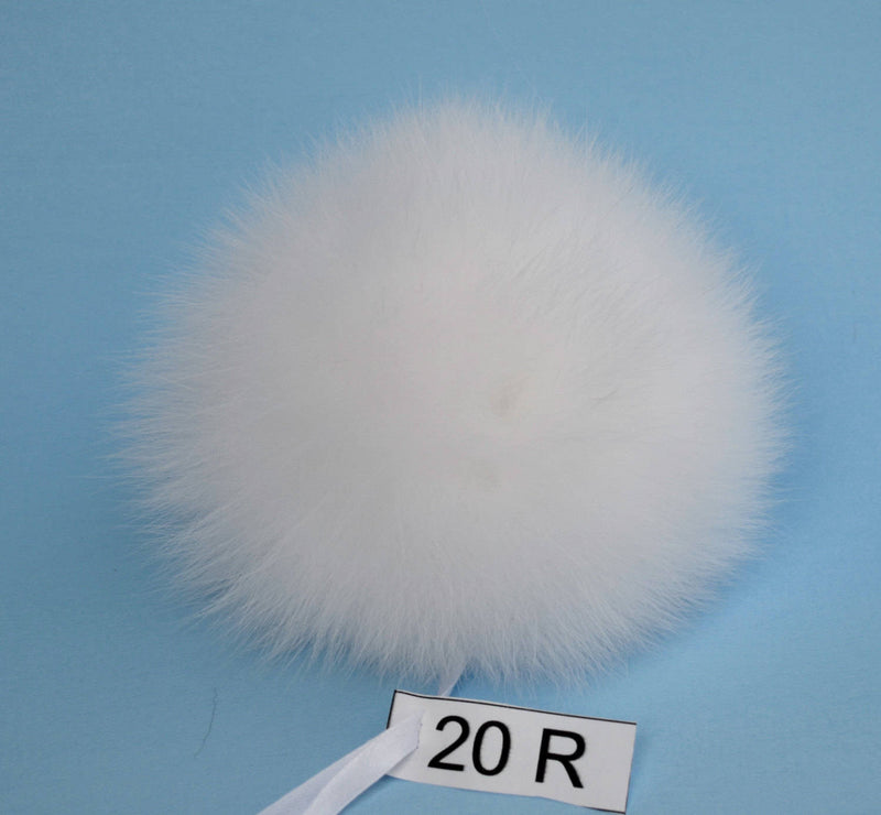 white fur pom pom ball