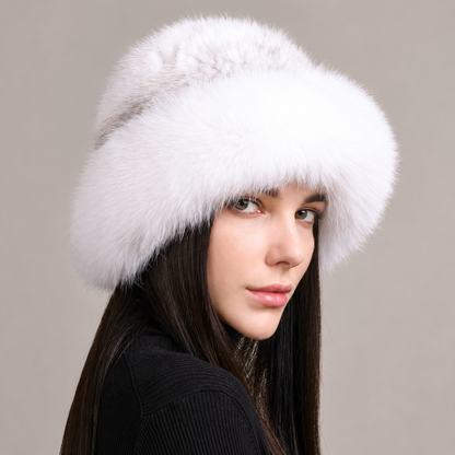 White knitted mink hat with a fluffy fox fur brim, shown on a model against a light background.