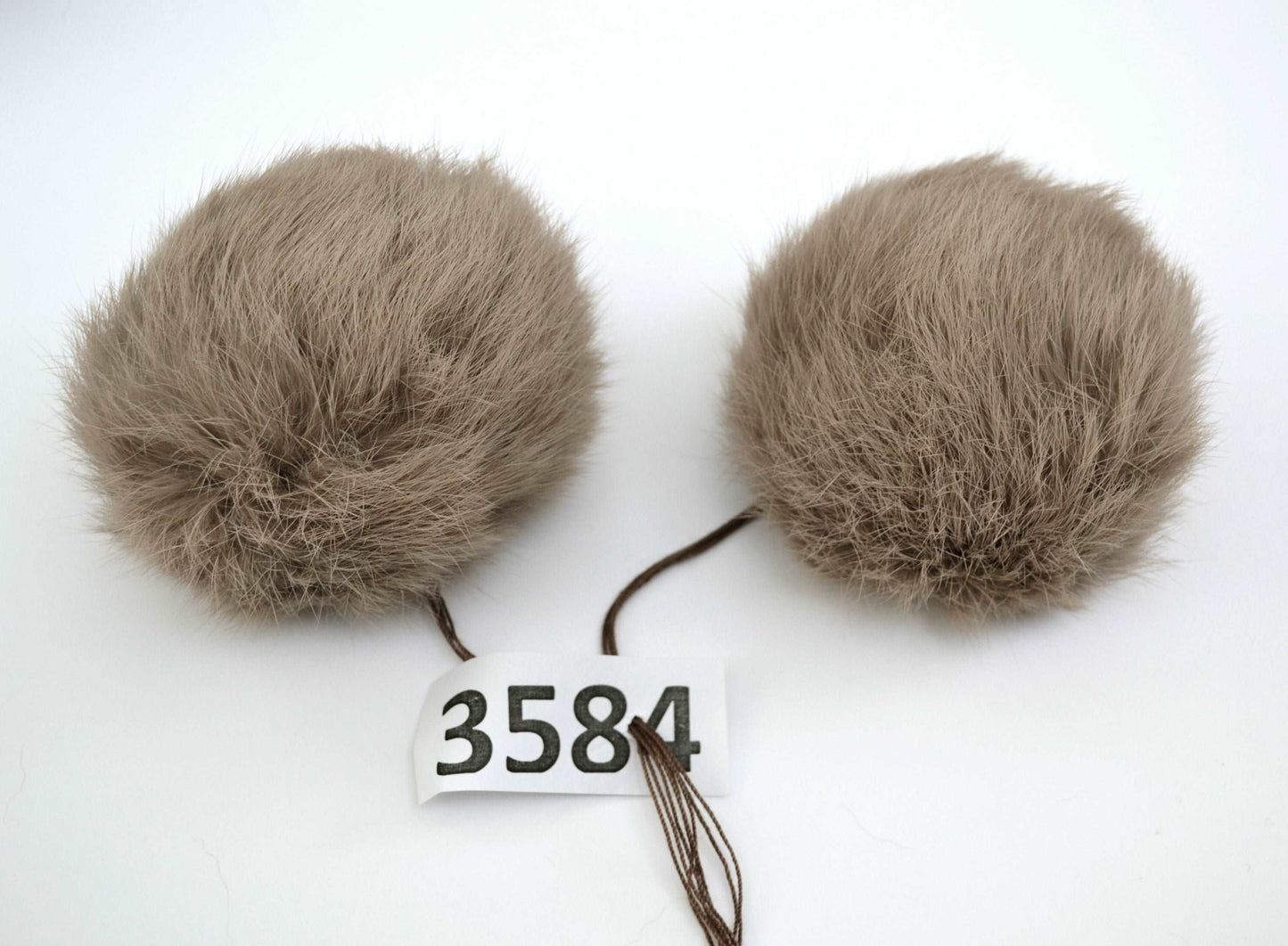 beige double rabbit pom pom