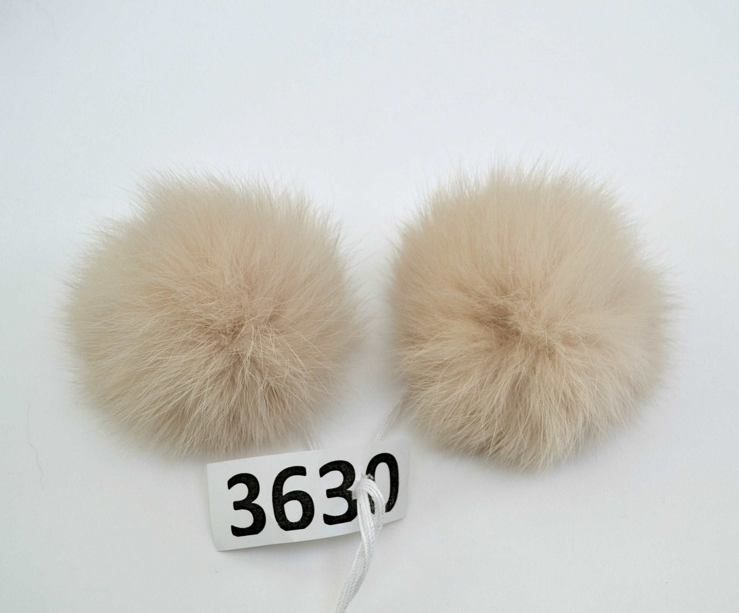 light beige double rabbit pom pom