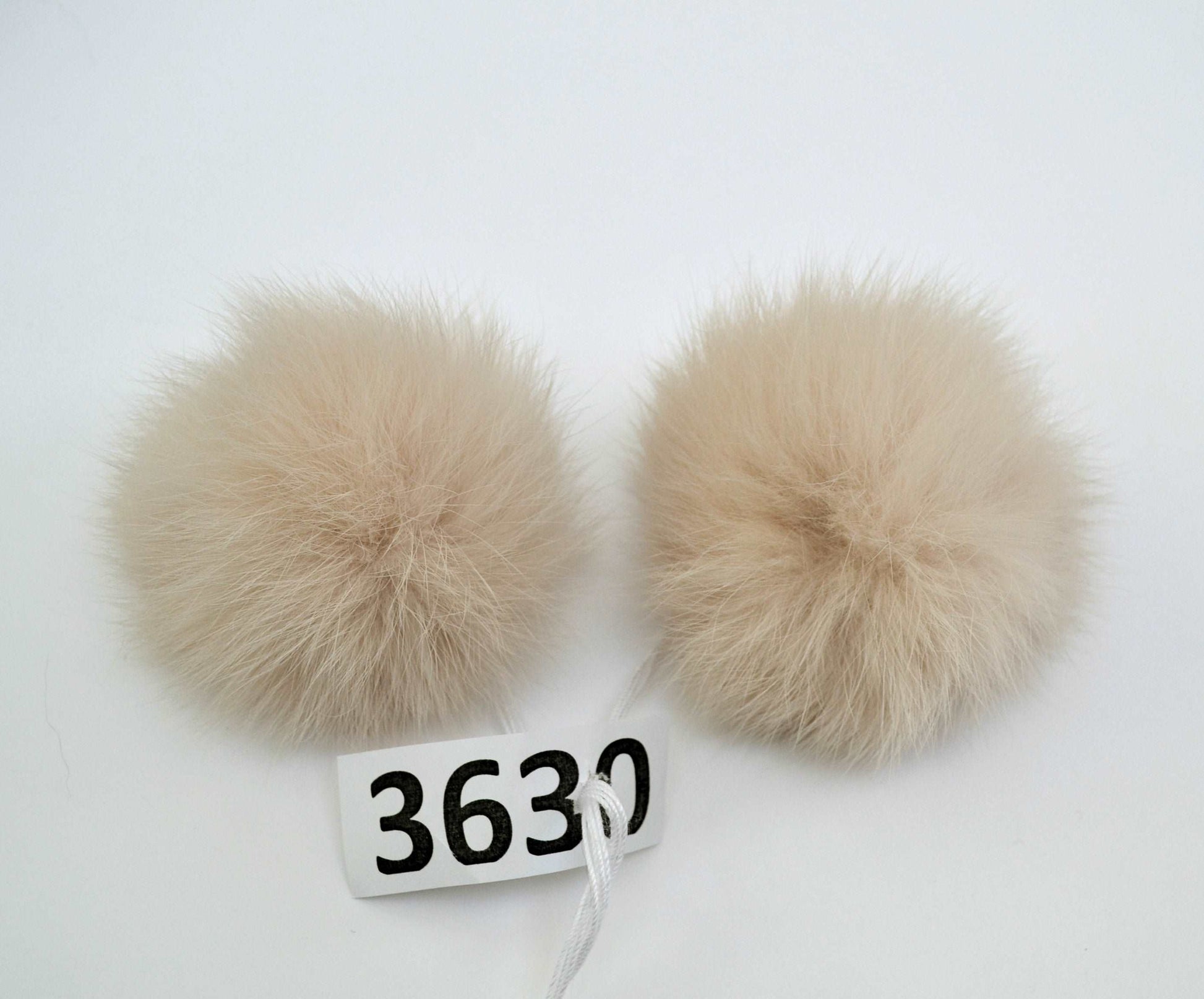light beige double rabbit pom pom