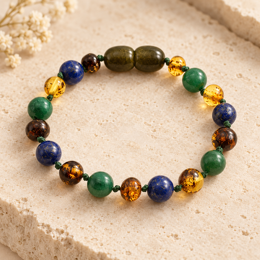 Baltic amber African jade and lapis lazuli bracelet on beige stone