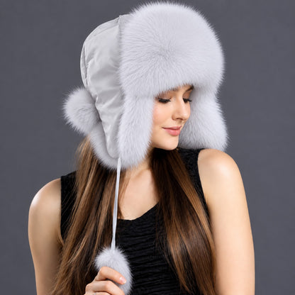 Blue fox fur ushanka hat side view with satin crown