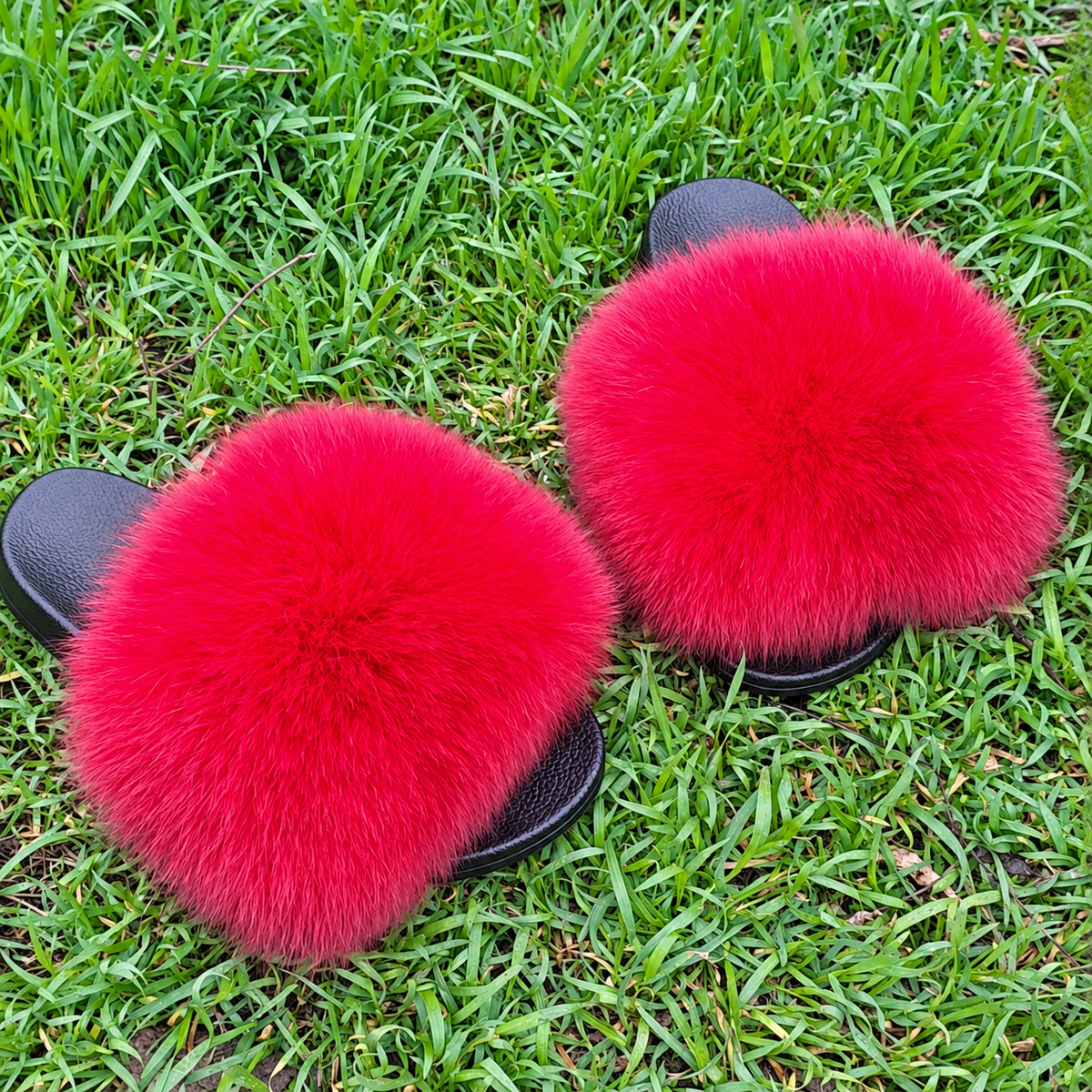 Bright red Arctic fox fur slippers and real fur slides – front view
