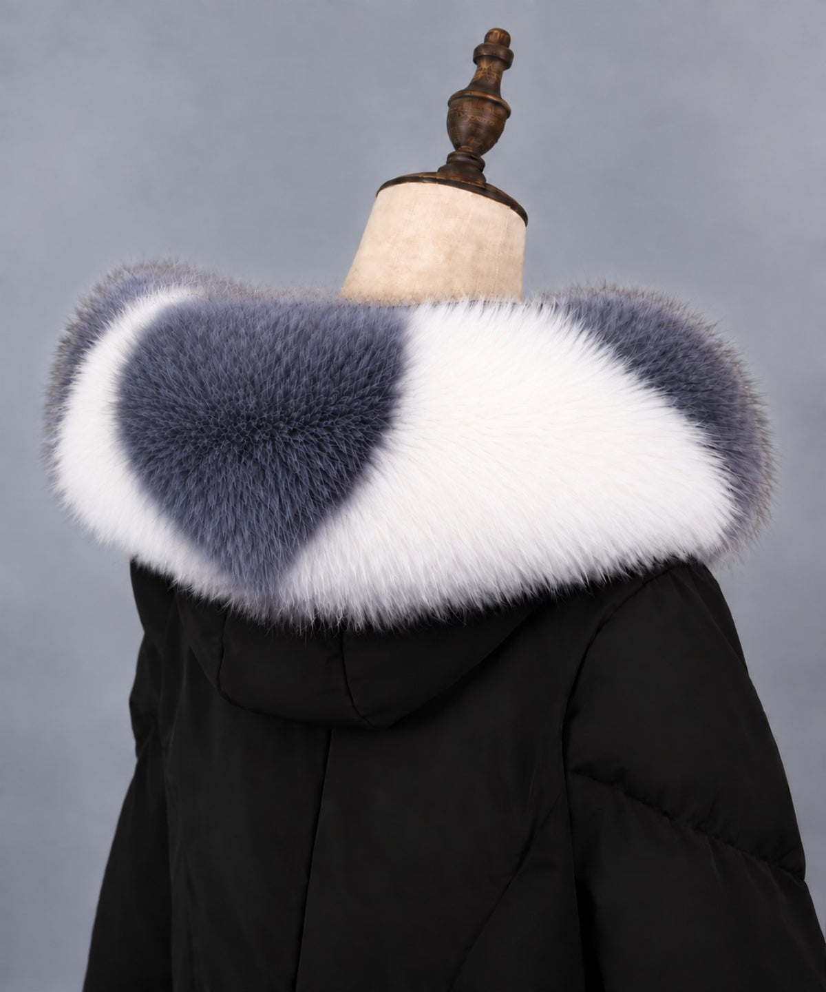 Gray and white real fox fur collar on black coat – angled back view