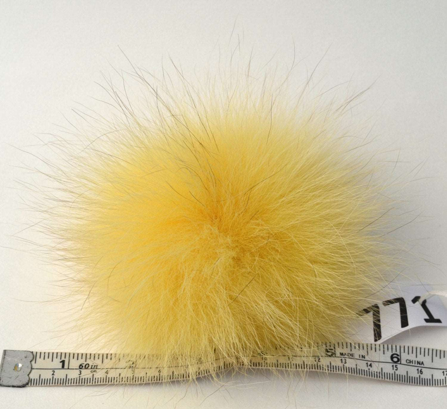 yellow fox pom pom