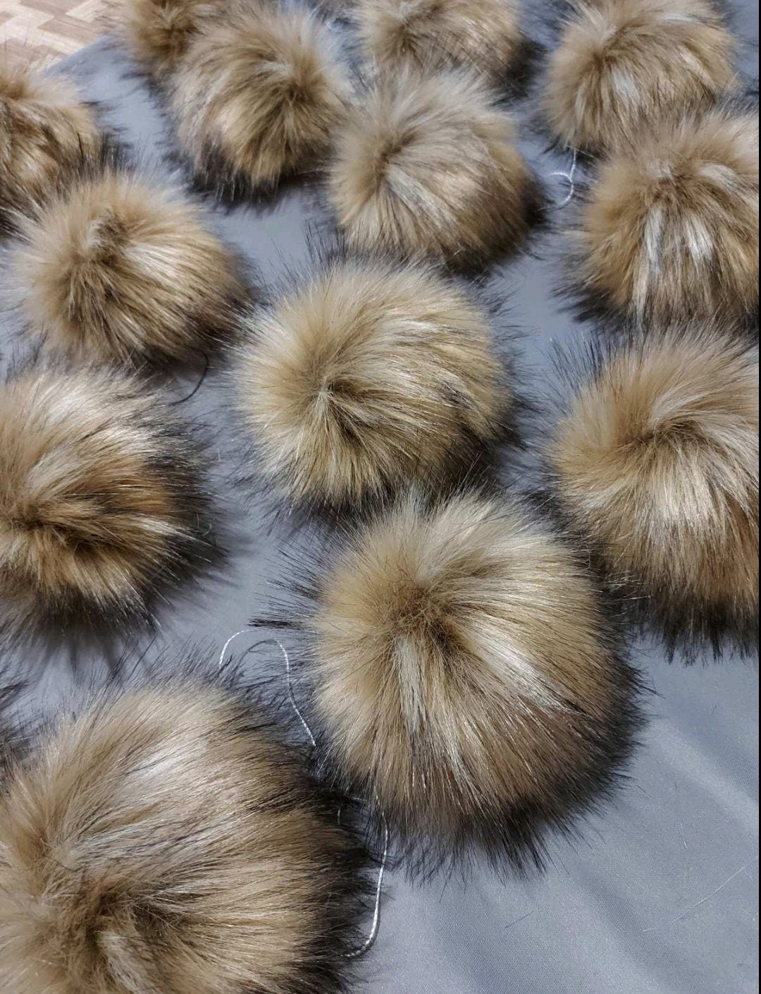 Large faux raccoon fur pom poms for hats and crafts – view 2