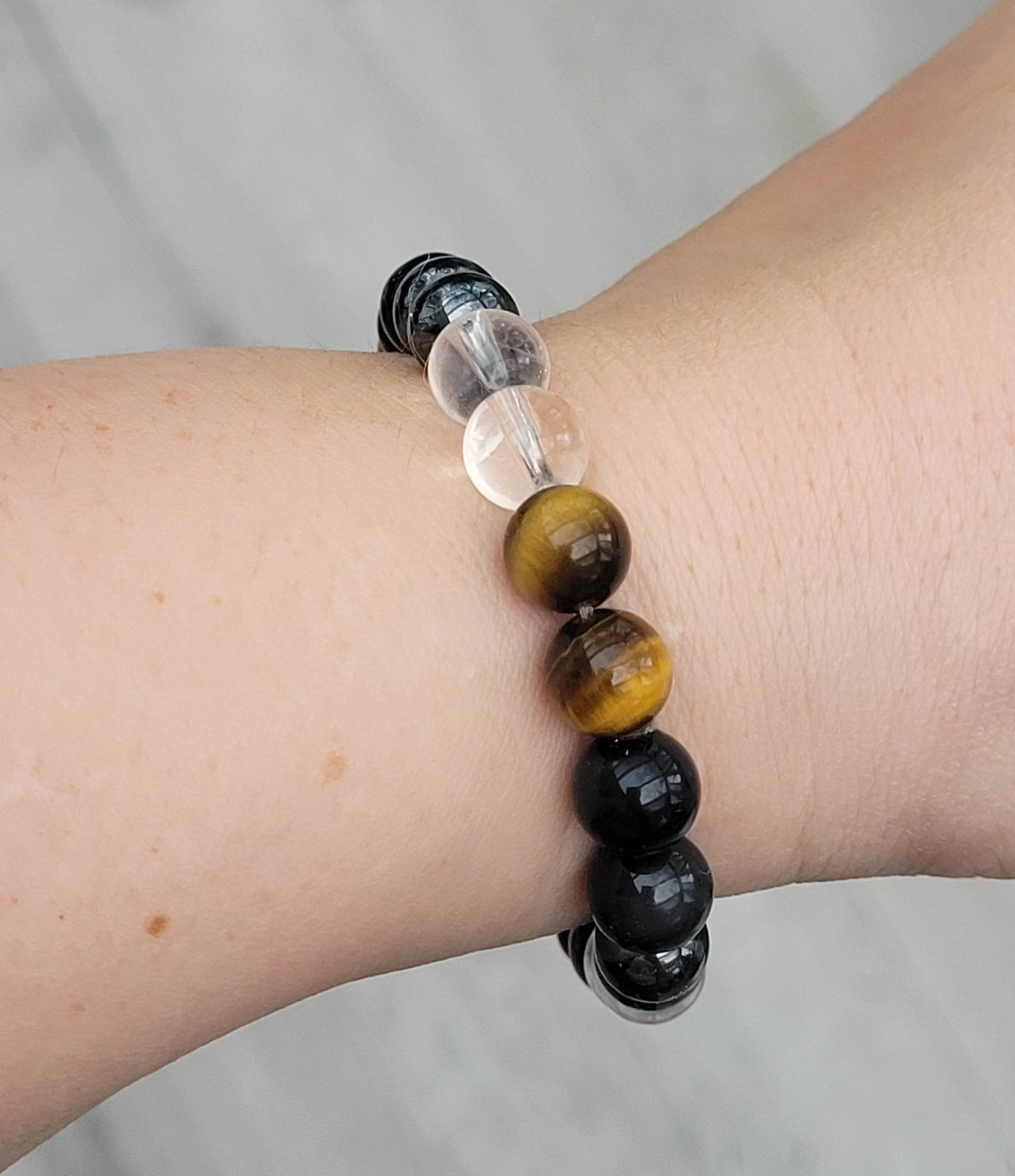 This is a beautiful handmade ULTIMATE QUADRUPLE PROTECTION BRACELET made of  100% GENIUNE 
 gemstone beads (from trusted Canadian supplier) that are the most powerful for the protection,  such as- Black Obsidian, Hematite, Tiger Eye and Clear Quartz