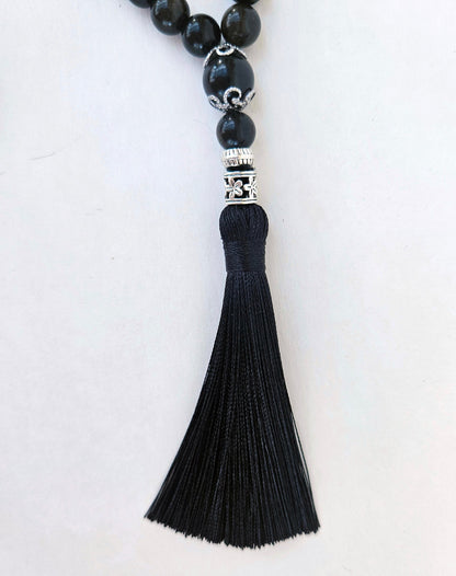 At the end of the rosary there is a  3-inch silk tassel serves as a pendant.