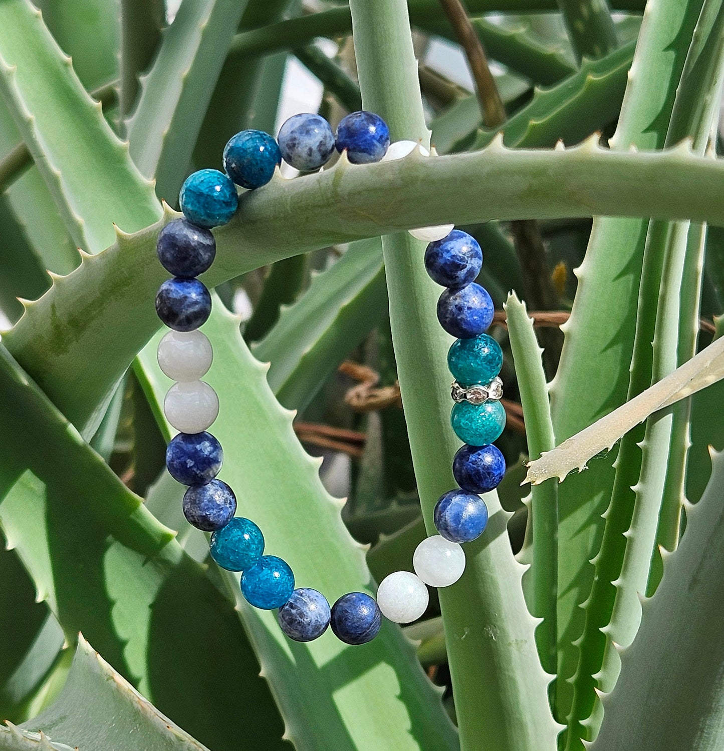 WATER ELEMENT BRACELET ( such zodiac signs as cancer, pisces, scorpio) features soothing blue and white gemstones like White Jade, Sodalite and Apatite to promote emotional healing, intuition, and creativity