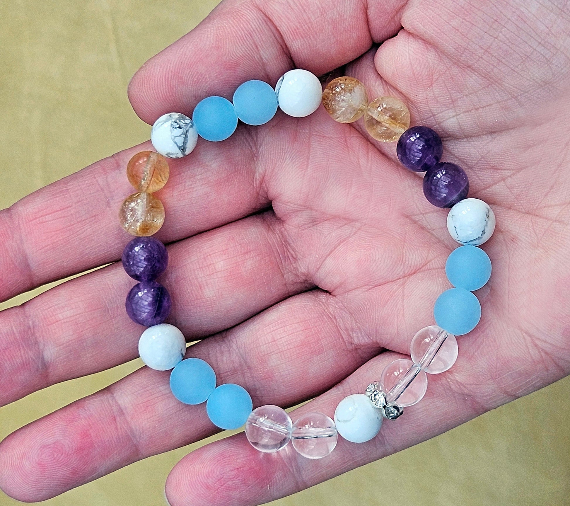 AIR ELEMENT BRACELET (such zodiac signs as gemini, libra, aquarius) includes white, blue, purple and yellow gemstones like Clear Quartz, Blue Jade, Howlite, Amethyste and Citrine to boost communication, mental clarity, and self-expression.