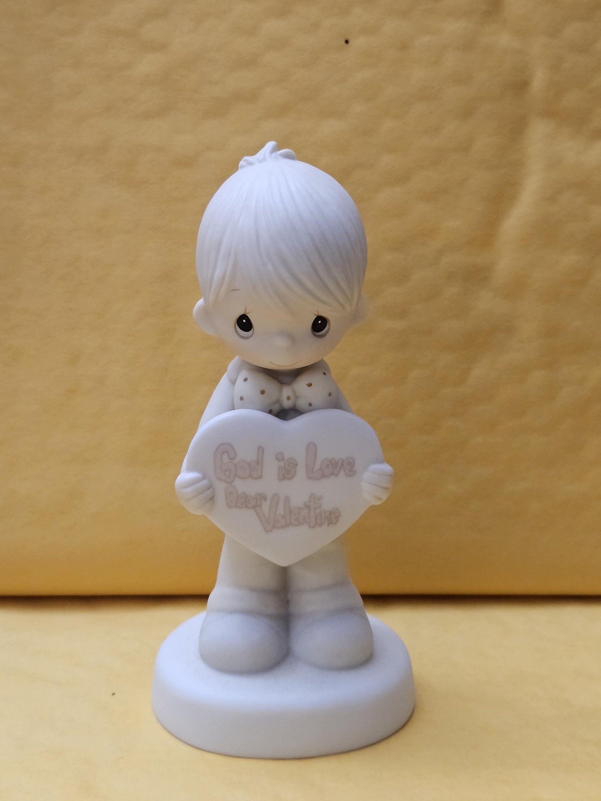 ** God is Love Dear Valentine **
- Measures approx. stands 5 1/2 inches tall
- Produced in 1981 (Precious Moments Jonathan & David)
- Model #E-7153
- Great condition, no chips or cracks. 
- hand-painted porcelain bisque
featuring a boy holding a heart