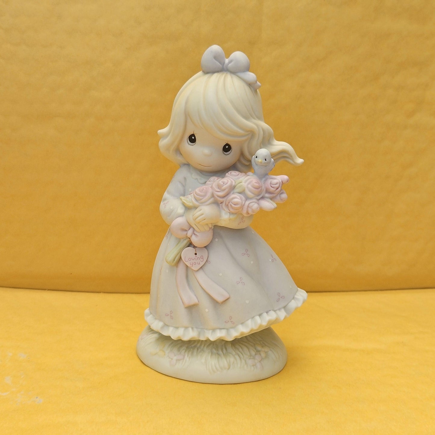 You Are My Happiness ** Limited to 1 year of Production, Precious Moments Collection
- Measures approx. stands 3.5" wide x 6.5" tall
- Produced in 1991 (Precious Moments, Samuel J.Butcher)
- Model #5261185
- features a girl talking by phone
- Great condition, no chips or cracks. 
- hand-painted porcelain bisque
-retired, rare