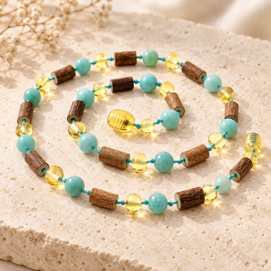 Lemon Baltic amber amazonite and hazelwood necklace on beige stone